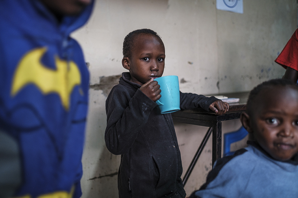 A child drinks milk at the Kibera Pride Children’s Home, in the city of Nairobi, Kenya, on October 27, 2023.