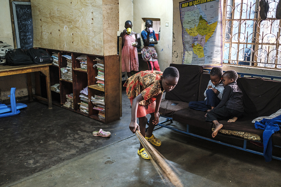 A child brooms the floor after breakfast time at the Kibera Pride Children’s Home, in the city of Nairobi, Kenya, on October 27, 2023.