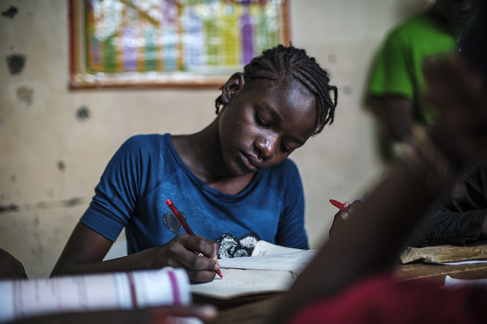 Banice Triza writes at the Kibera Pride Children’s Home, in the city of Nairobi, Kenya, on October 27, 2023.