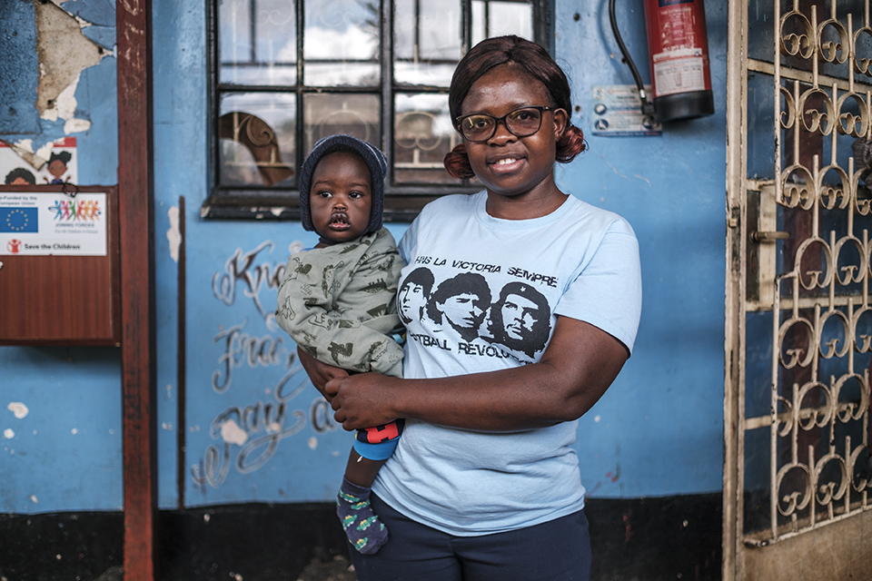 Irene Kasandi, director, holds a baby at the Kibera Pride Children’s Home, in the city of Nairobi, Kenya, on October 27, 2023.