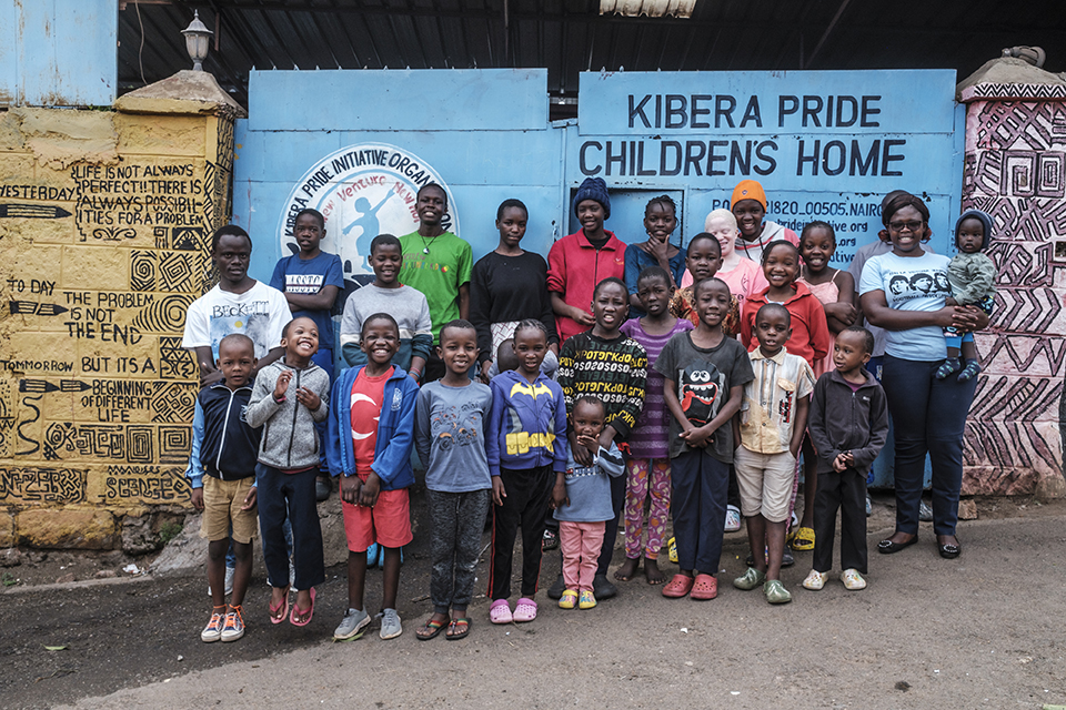 Children are portrayed at the gate of the Kibera Pride Children’s Home, in the city of Nairobi, Kenya, on October 27, 2023.