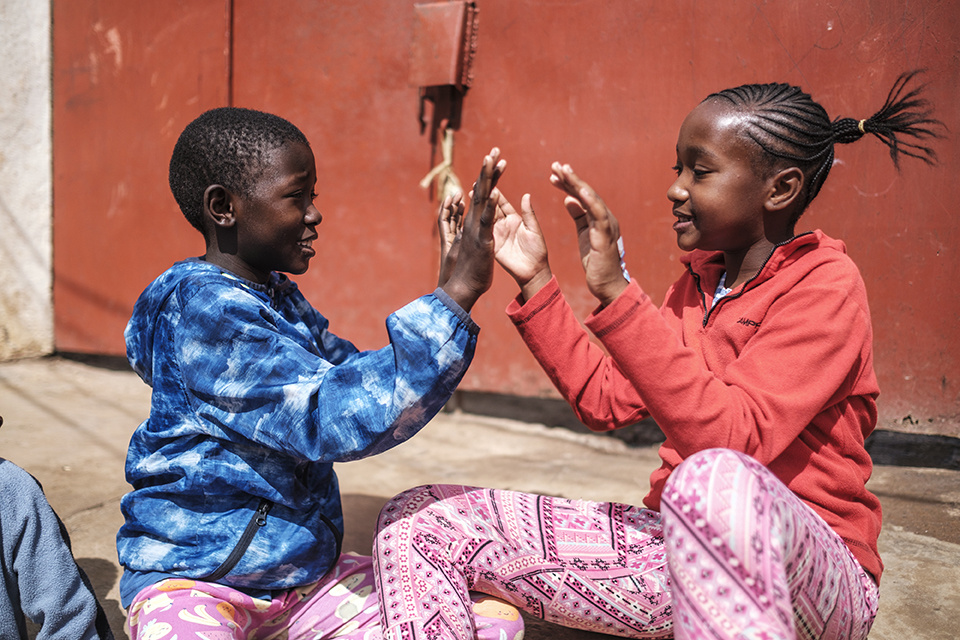 Children play on a street in front of the Kibera Pride Children’s Home, in the city of Nairobi, Kenya, on October 27, 2023.